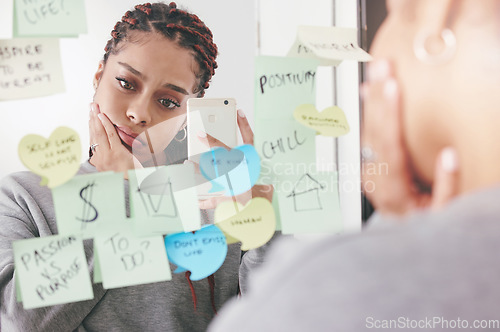 Image of Sad, depression and anxiety woman selfie with phone and reading sticky notes on a mirror in a room. Upset and unhappy girl reading motivational, positive affirmation and self care post it reminder.