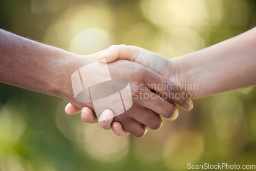 Image of Community, handshake and support hand sign of diversity to show solidarity and trust. Welcome or greeting of hands together showing collaboration, partnership or deal agreement outdoors with bokeh