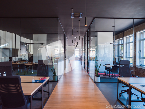 Image of In a setting of modern, glass-walled business startup offices, the open, airy workspace reflects a contemporary and innovative ambiance, promising a dynamic environment for entrepreneurial growth