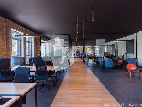 Image of In a setting of modern, glass-walled business startup offices, the open, airy workspace reflects a contemporary and innovative ambiance, promising a dynamic environment for entrepreneurial growth