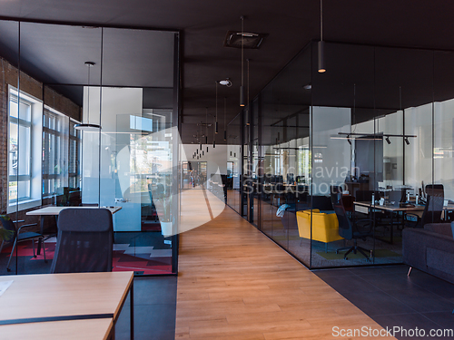 Image of In a setting of modern, glass-walled business startup offices, the open, airy workspace reflects a contemporary and innovative ambiance, promising a dynamic environment for entrepreneurial growth