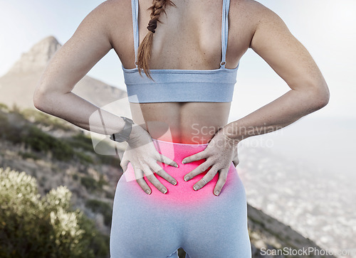 Image of Lower back pain, sports injury and woman holding sore body part after training, exercise and workout with glowing red sportswear. Runner, sports female and athlete outside for fitness and relief