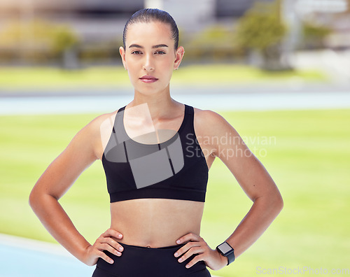 Image of Woman, fitness and runner at stadium track for training, exercise and workout with marathon goals. Athlete portrait, wellness sports motivation or personal trainer with speed and cardio health target