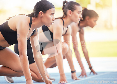 Image of Women start sports race, running competition and marathon training, fitness event and challenge in outdoor stadium. Focus, mindset and group runners ready in speed, power and fast olympic sprint line