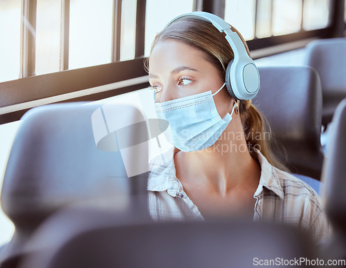 Image of Covid face mask, headphones and woman on bus sad or worried while listening to podcast or music. Person travel in city train transportation with 5g and audio live streaming corona virus news update