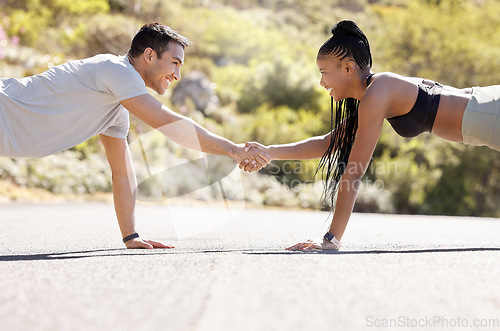 Image of Motivation, fitness and handshake by exercise partnership deal with athletic couple shaking hands in workout challenge outdoors. Friends, hands and pushup fun with sports, bonding and competitive