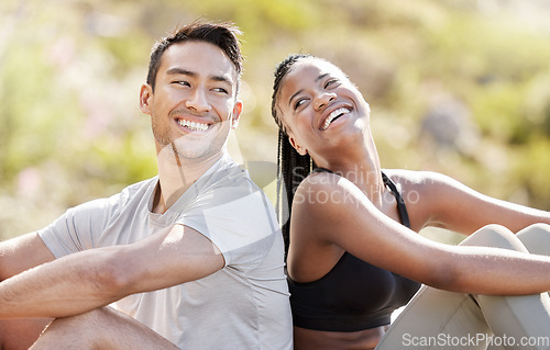 Image of Couple rest after mountain hiking nature adventure, young black woman and Asian man relax together. A hike is good for fitness, a free way to see landscape and natural beauty of earth when traveling