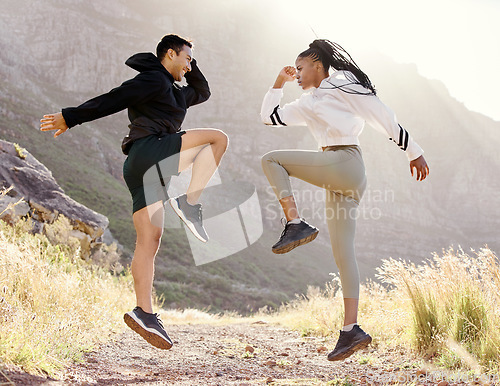 Image of Fitness, nature and couple exercise in mountain hill, jump wellness and outdoor cardio workout on dust path. Motivation, health and sport partnership or friends in sports training or active lifestyle