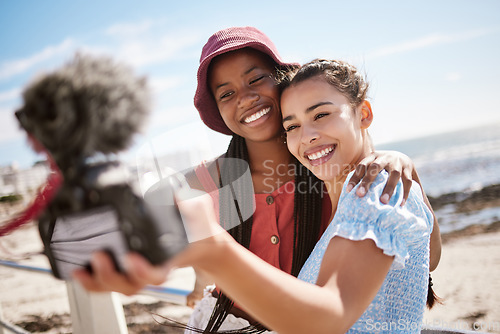 Image of Women friends, influencer and summer selfies on live streaming holiday, beach travel and video podcast for social media in Miami Florida. Happy gen z young people taking photos at promenade outdoors