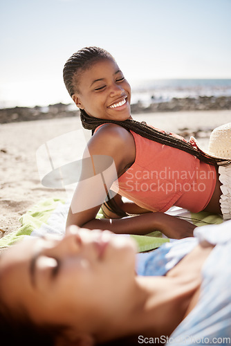 Image of Friends, tanning and relax in the sun on the beach during summer vacation outdoor. Ocean travel holiday with women living a life of leisure and getting a natural tan in nature at the sea while rest