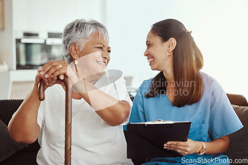 Image of Senior care, healthcare insurance and caregiver woman sitting with elderly woman patient laughing and talking while enjoying retirement home. Old lady and female nurse hospice with health check form