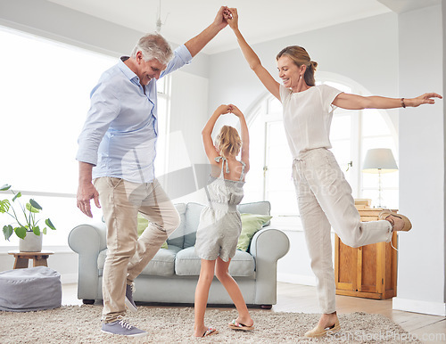 Image of Girl dance with grandparents on living room, have fun and happy time in home. Senior man, smile in house with woman and child, dancing and playing together in their lounge at family home