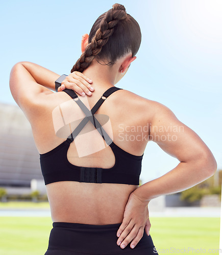 Image of Fitness woman back pain, spine injury and neck problems at sports training stadium outdoors. Athlete fracture, health emergency and scoliosis risk from exercise workout, body stress and muscle bruise