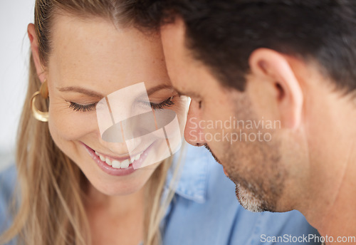 Image of Love, family and couple in their home together, married and sharing intimate moment. Portrait of romantic, smiling and loving man and woman in happy marriage touching foreheads, face and eyes closed