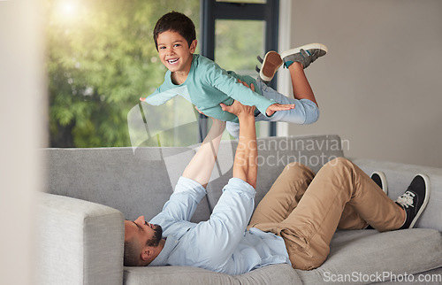 Image of Happy family, love and father and son bonding on a sofa at home, playing and being creative with a fun game. Energy, fantasy and airplane pose by happy boy enjoying free time with his caring dad