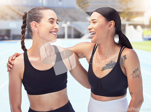 Image of Fitness, sports women friends or personal trainer people hug and smile for support, motivation and workout goal at outdoor stadium with lens flare. Athlete couple at arena happy with training results
