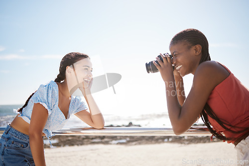 Image of Summer, photographer and friends at a beach, having fun and posing for photograph on a sea trip together. Travel, happy and women bonding on a Florida vacation, relaxed and cheerful in with a camera