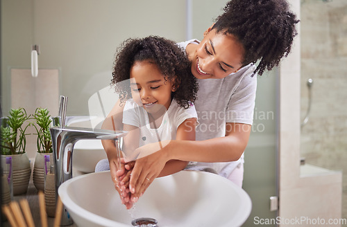 Image of Family, washing hands and child with mom rinsing, cleaning and good hygiene against bacteria or germs for infection or virus protection in bathroom. Girl kid with woman for health and cleanliness