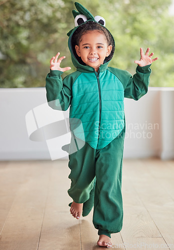 Image of Creative, child and halloween costume by girl running in a crocodile suit, playing and laughing at home. Fantasy, happy and face of a kid excited to celebrate a fun festival, enjoying a break to play