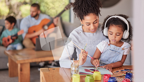 Image of Creative family, mom and girl doing art and craft with dad and in background with guitar in home. Painting, child development and parents love for children, a mother from brazil and kid with paint.