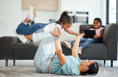 Image of Family flying, helicopter game and mother being funny with children in house living room, care on the floor and smile for love in the lounge of home. Happy girl playing with her mom together