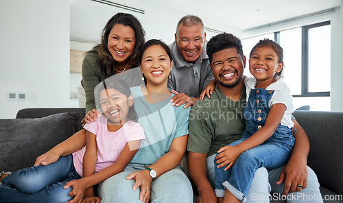 Image of Family, children and love with kids, grandparents and parents sitting on a sofa in the living room of their home during a visit. Happy, smile and together with a senior man, woman and their relatives