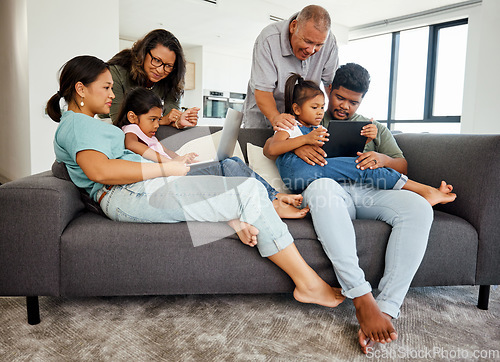Image of Family, children and technology with a kids, grandparents and parents streaming in the living room. Girl, sister and senior relatives watching an online subscription service together in their home