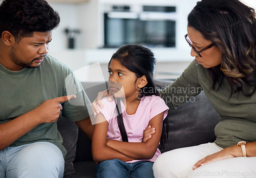 Image of Family, discipline and fight with parents and girl in living room talking for communication, warning or problem. Frustrated, conflict and sad with dad, mom and child with behaviour stress or angry