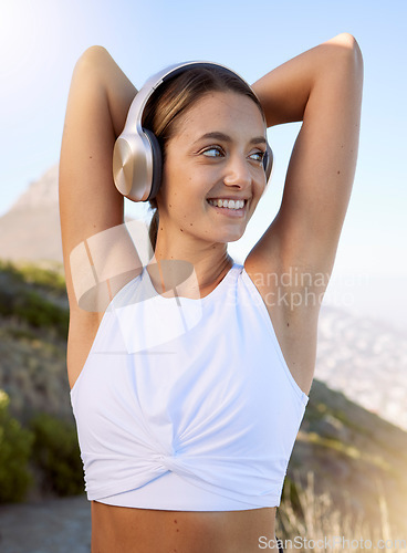 Image of Workout woman, headphones music and fitness after a exercise training, run or health sport outdoor. Happy smile of a strong young female athlete with happiness from cardio ready for sports in nature