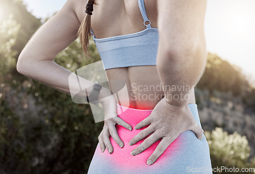 Image of Back pain, injury and hurt muscle after a workout or running. Woman holding lower back muscles in pain after exercise and run. Backache, injured athlete and inflammation in sports accident