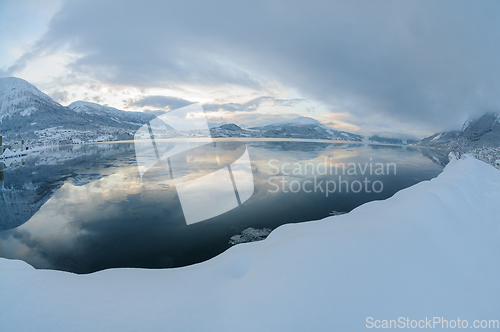 Image of Snowy Mountains and Body of Water