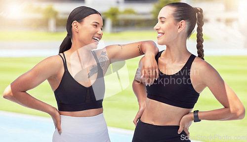 Image of Smile, happy and fitness friends joke at stadium at training, running and cardio workout together. Women, happiness and healthy runners laughing on sports racetrack at exercise and practice in summer