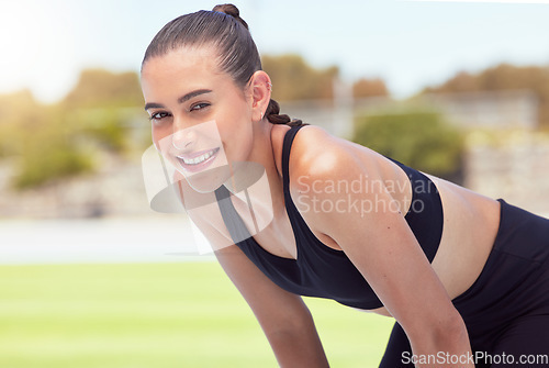 Image of Sport, exercise and fitness with a sports woman training during a workout for health, wellness and cardio. Healthy, strong and lifestyle with a young female athlete standing outdoor after a routine
