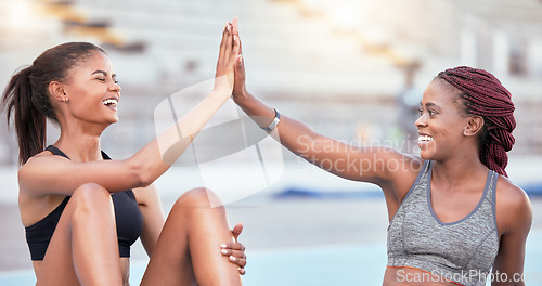 Image of Support, high five and black woman running team winner at athlete practice in stadium. Congratulations, motivation and success at workout training with happy and joyful fitness friends.