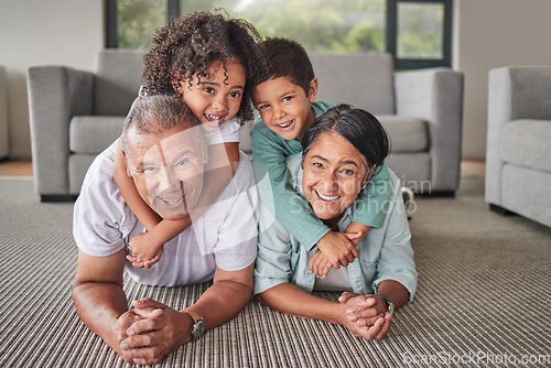 Image of Grandparents, children or bonding in fun play game on house or family home living room floor. Portrait, smile or happy senior man and mature woman babysitting grandchildren or kids together in lounge