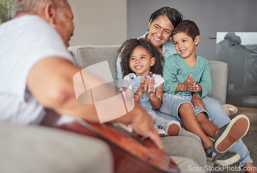 Image of Grandparents, children and clapping for guitar music on house or home living room sofa. Smile, happy or bonding kids with retirement woman and elderly senior man listening to creative family musician