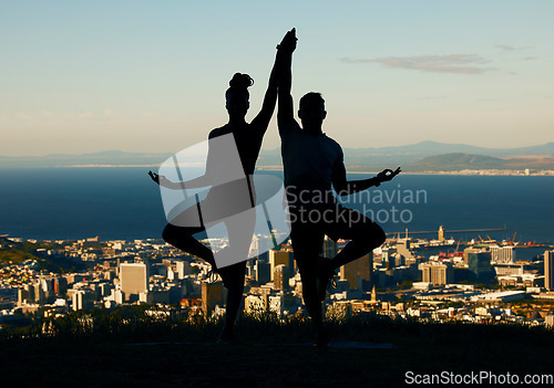 Image of Couple, silhouette and yoga in spiritual fitness and wellbeing against a city background. Dark shadow of people in meditation exercise balance together in healthy mind, body and spirit in calm nature