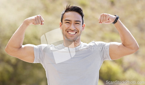 Image of Sport, fitness and exercise with a flexing man showing his muscles and biceps while proud of his strong build. Workout, training and health with a muscular young male athlete or bodybuilder outdoor