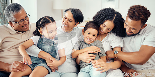 Image of Portrait, children with grandparents in a big family as mother and father hugging boy on the sofa or couch. Dad mom and young kids happy to enjoy bonding with lovely grandmother and old man at home