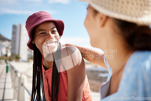 Image of Black woman friends at the beach in an urban city for summer, vacation or holiday with sunshine in Miami. Happy travel couple or gen z people with smile for outdoor vitamin d near ocean