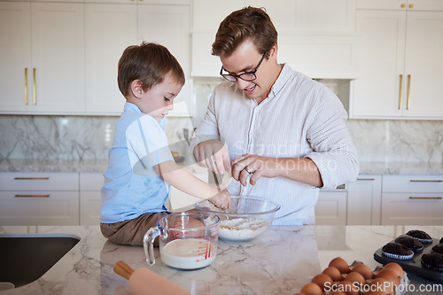 Image of Father, son and baking teamwork on kitchen counter together love to bond, food and cooking flour, milk and egg pastry. Fun, smile and happy dad teaching kid healthy cookies bake recipe in family home