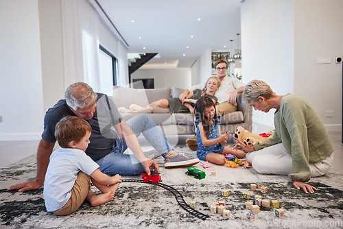 Image of Family care, children love and grandparents happy with toys in living room with kids, smile train game and teddy bear in house. Mother and father relax on couch with elderly people and sibling games