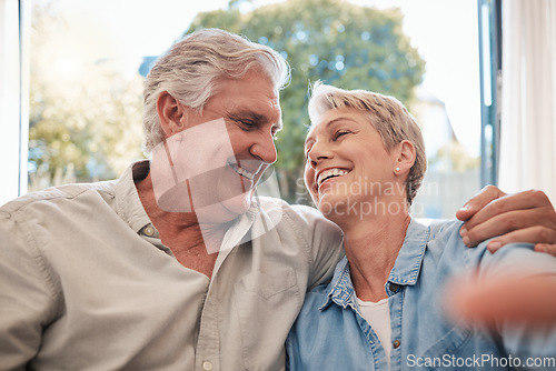 Image of Love, elderly and selfie with retirement couple in home relaxing with romantic eye contact. Married and happy pension people in relationship with care, trust and respect photograph together.