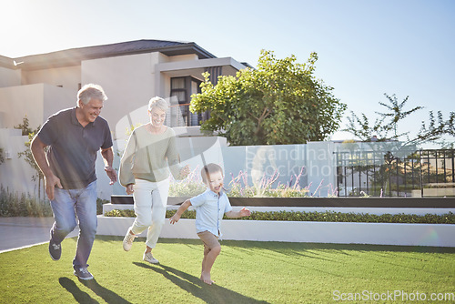 Image of Family running, happy garden and child happy on grass with grandparents, smile for exercise in backyard and fitness together in nature. Grandmother and man playing with kid in park by house in summer