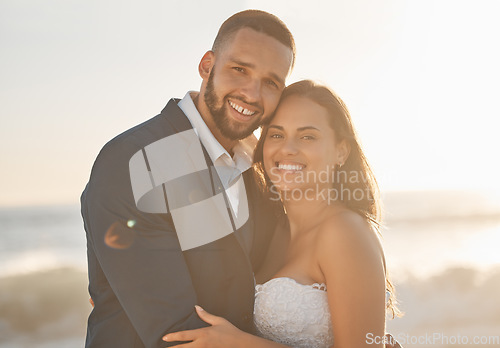 Image of Love, couple and wedding portrait of bride and groom hug and bonding at beach, happy and cheerful. Freedom, romance and just married couple excited for ocean trip and honeymoon, celebrating marriage