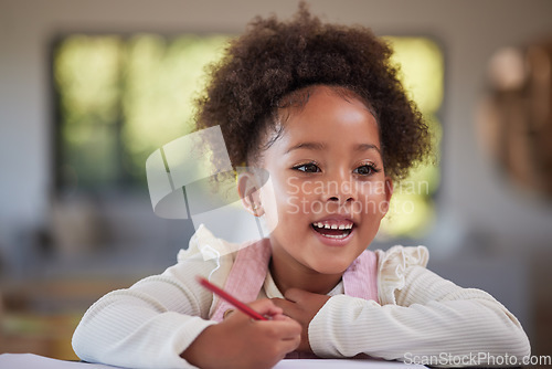 Image of Child, learning and writing for education, homework and drawing with jamaica preschool girl using pencil at home. Happy and curious student kid doing art during homeschool studying at table to learn