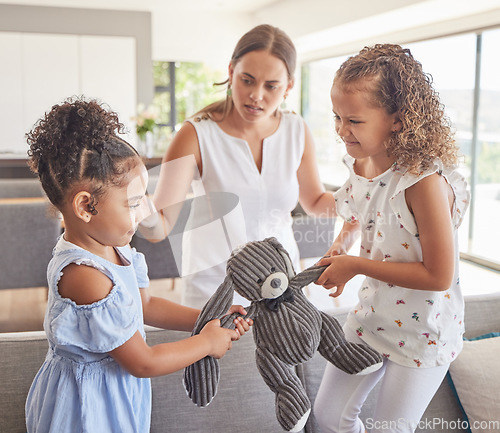 Image of Toys fight, angry children and mother confused about kids in conflict, talking about problem and family communication in house. Girl siblings upset about teddy bear with mom in home living room