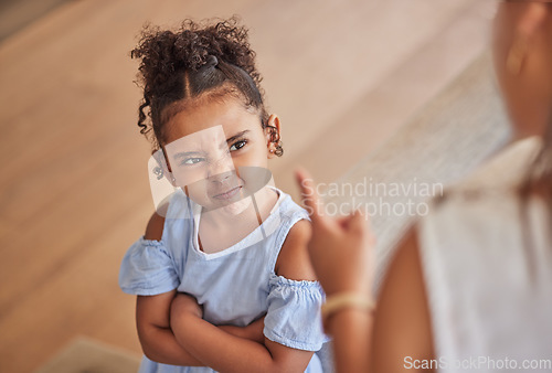 Image of Angry child and tantrum discipline conflict for attitude problem in home with stressed mother. Young girl frustrated, unhappy and moody at disappointed adult punishment for negative behaviour.