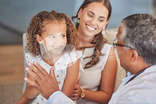 Image of Child doctor, pediatrician and high five with happy girl patient with mom parent during health checkup with healthcare insurance. Latino kid and woman celebrate with man gp in Puerto Rico hospital