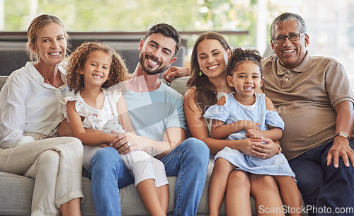 Image of Interracial family, happy portrait and parents on the living room sofa with children, relax in lounge together and smile on the couch. Kids, mother and father with love for senior people in house